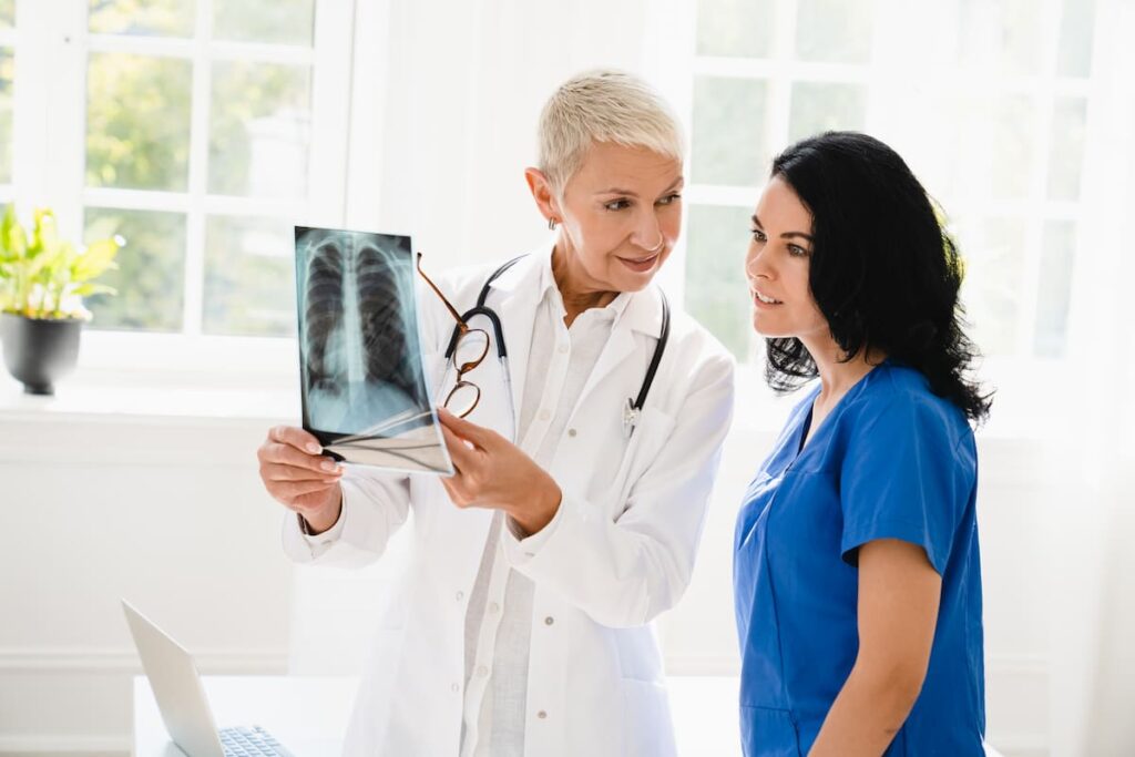 doctor-showing-x-ray-image-to-nursing-student